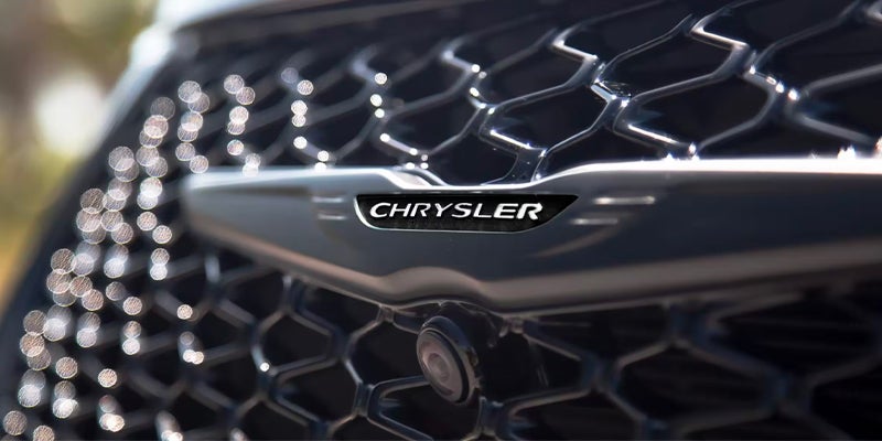 the chrsyler emblem on the front of the pacifica