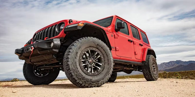 A red jeep parked outdoors.