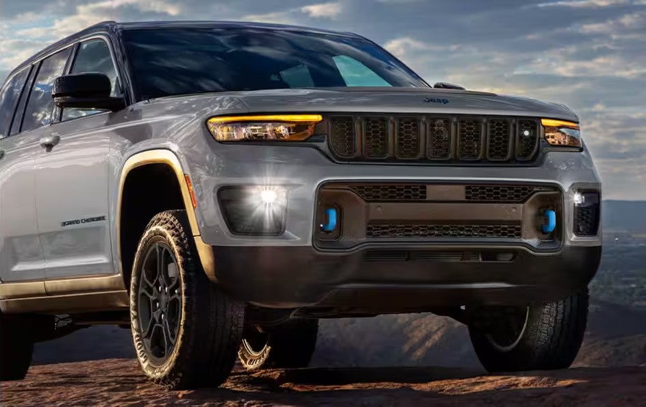 front of a jeep grand cherokee with the led headlights on.