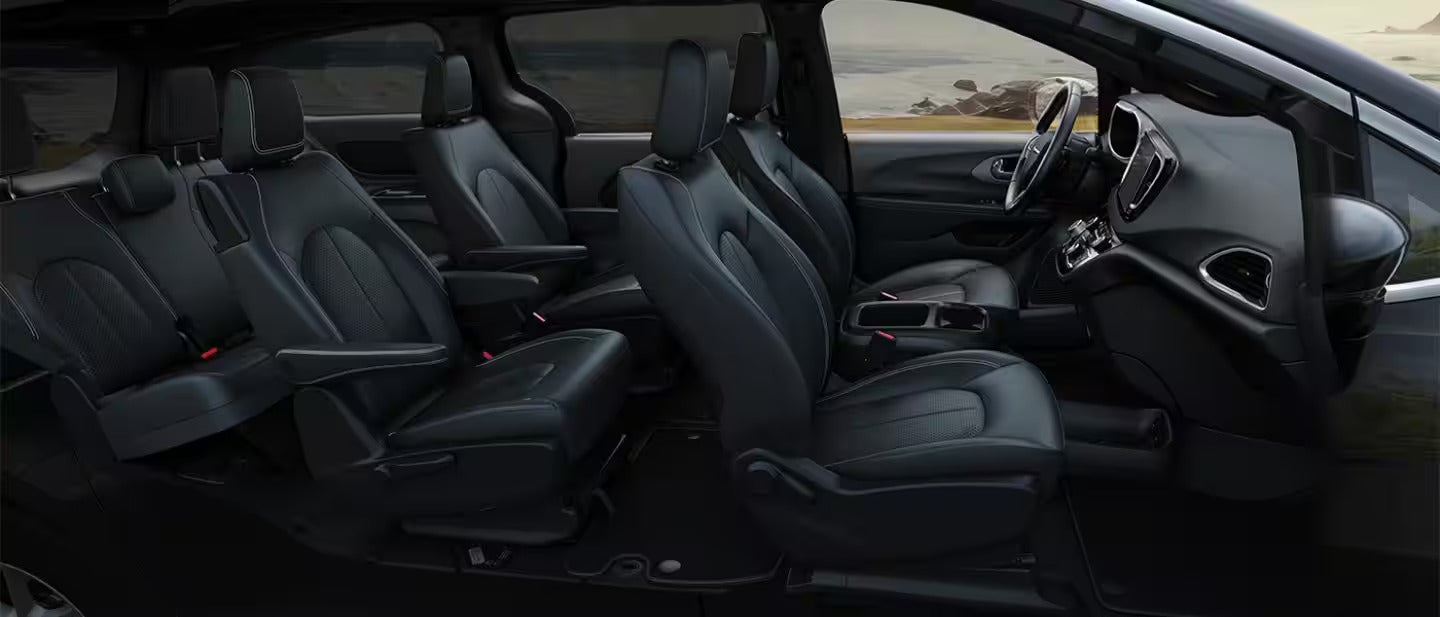 side profile of the interior front and 2nd row seating in a chrysler voyager
