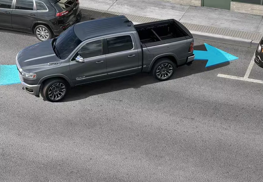 A ram 1500 backing into a parking spot.