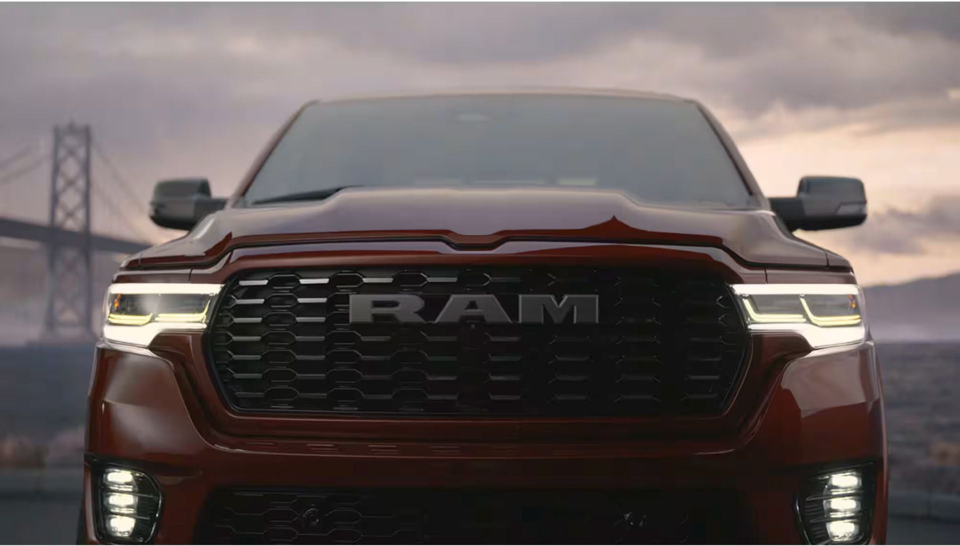 A close look at the front of a red truck.