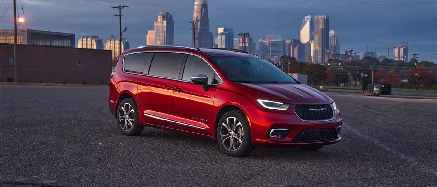 2026 Chrysler Pacifica parked in front of the city sky line