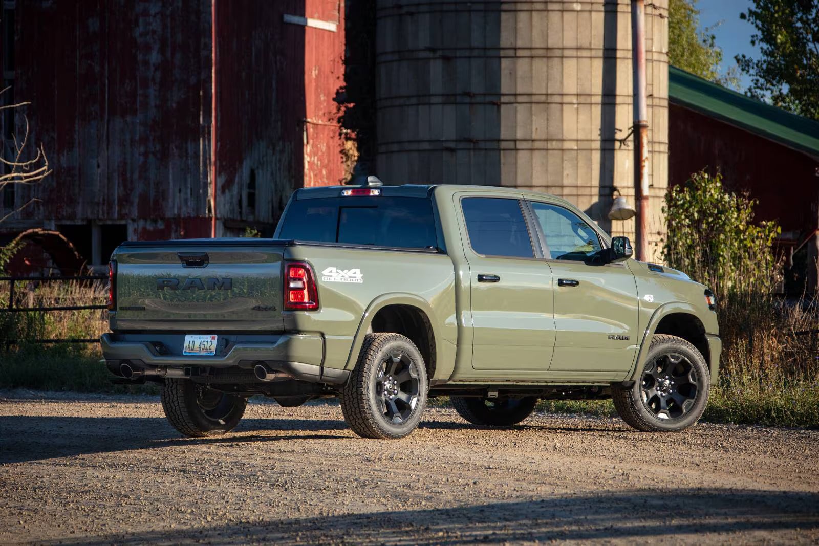 2026 ram 1500 parked next to a grain silo and red barn